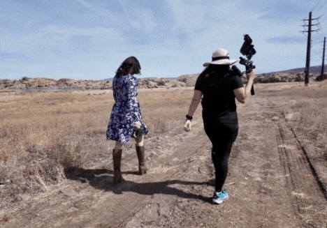 Videographer guiding an agent during an outdoor property video shoot