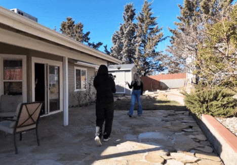 Real estate agent recording a property video with a videographer